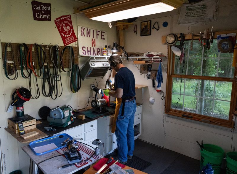 Bernie Engels works in his knife shop on Monday, June 8, in Hamilton.