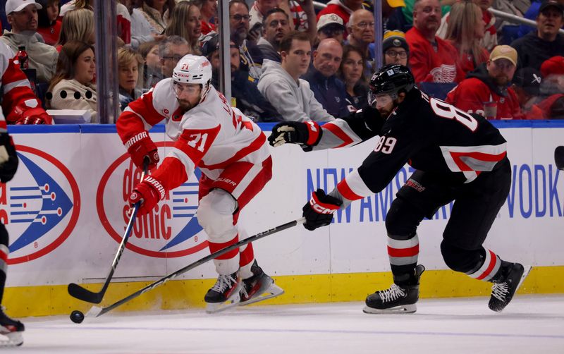 Buffalo Sabres right wing Alex Tuch (89) tries to block a pass by Detroit Red Wings center Dylan Larkin (71) during the third period Oct 26, 2024; at KeyBank Center.