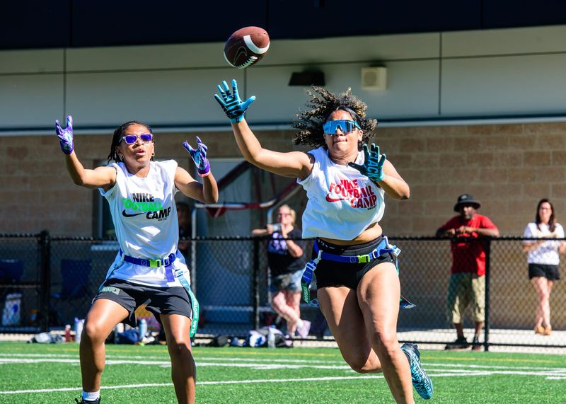 Redford Union's Amaya Tigney breaks on a ball for an interception during the Nike Girls Flag Football Showcase and Prospect Camp on Friday, June 12, 2026, at Birmingham Groves High School.