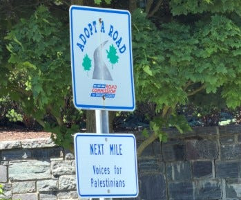 An Adopt-A-Road sign in West Bloomfield Township dedicated to "Voices for Palestinians" is seen.