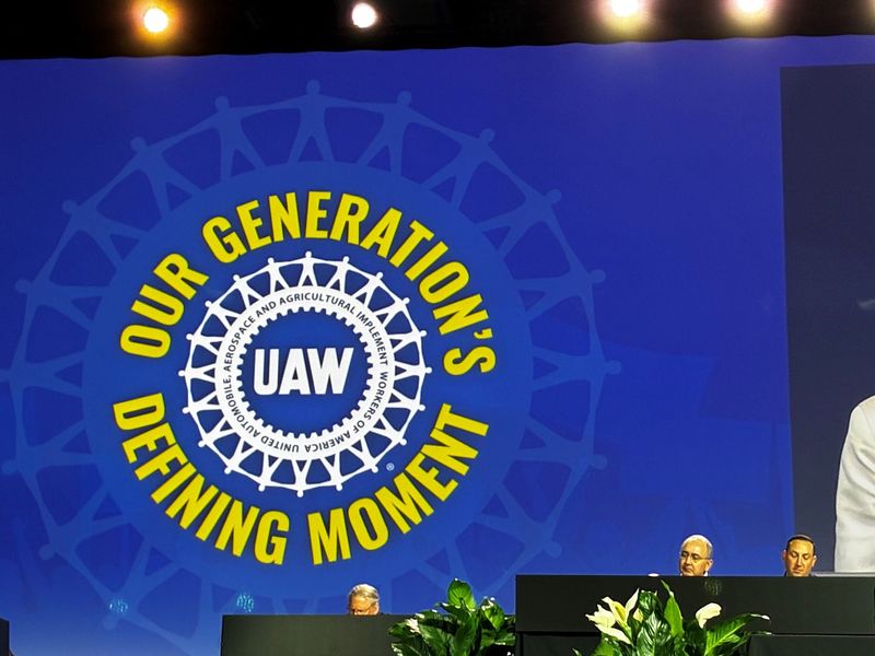 UAW President Shawn Fain, second from right, is seeking a second term and will look to solidify support at the union's constitutional convention in Detroit this week.