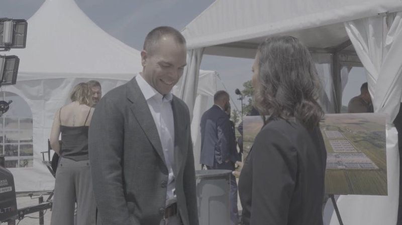 Oracle CEO Clay Magouyrk laughs as Michigan Gov. Gretchen Whitmer says "we’re used to people saying no and doing it anyway" after a June 1 groundbreaking ceremony for Oracle and OpenAI's new data center in Saline Township. The exchange, which is only partially audible, was captured by videographer Priscilla Creswell.