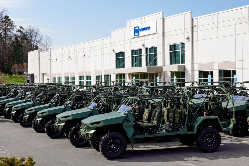 Several Infantry Squad Vehicles parked in front of GM Defense’s Concord, North Carolina production facility.