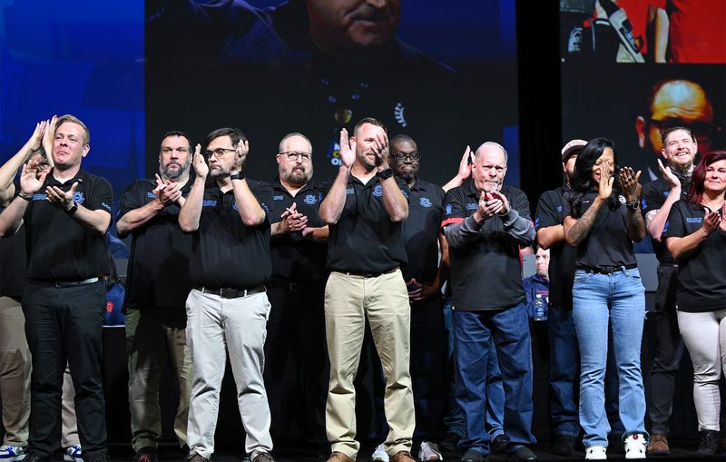 Members of UAW Local 42 from the Volkswagen plant in Chattanooga, Tennessee, applaud during a standing ovation in their honor for winning a new contract for their members during the UAW Constitutional Convention on Tuesday, June 16, 2026, in Detroit.