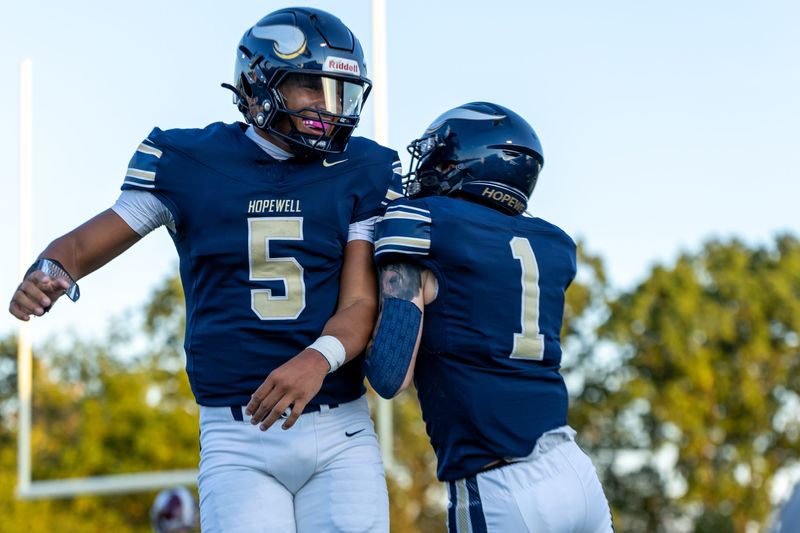 Hopewell quarterback James Armstrong (5) and wide receiver Kingston Krotec (1) celebrate after connecting for an opening drive touchdown during the WPIAL Class 3A Western Hills Conference game between Beaver Area and Hopewell at Tony Dorsett Stadium Friday Sept. 12, 2025 in Hopewell Township, Pa.