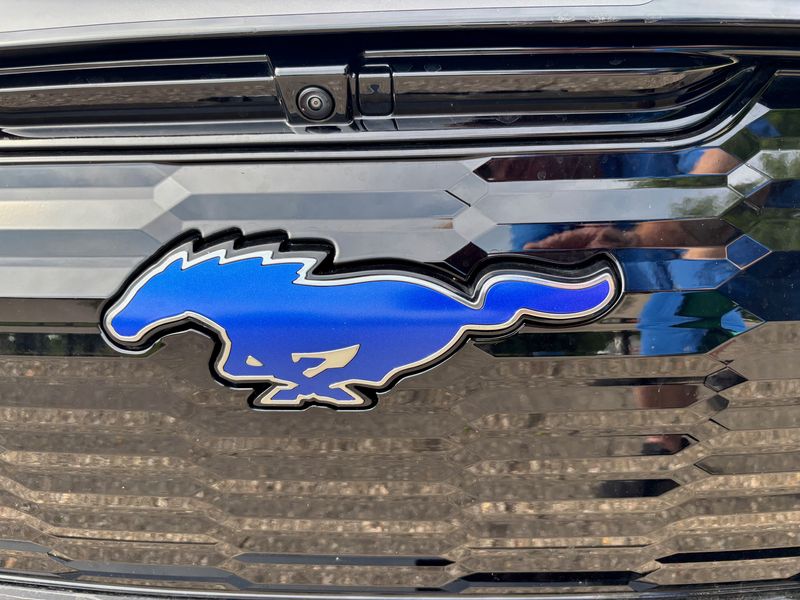 The Ford Mustang Mach-E features an update of the famous pony badge.