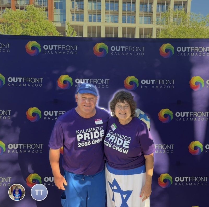 Michelle and Troy Zukowski-Serlin are pictured at the Kalamazoo Pride event on June 6, 2026. His hat had an Israel flag, and she wore a dress with a Star of David. Their outfits drew a backlash from the group OutFront Kalamazoo.
