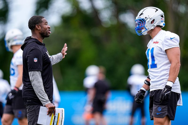 Detroit Lions linebackers coach Shaun Dion Hamilton, left, talks to linebacker Jimmy Rolder (41) during mini camp at Meijer Performance Center in Allen Park on Wednesday, June 17, 2026.