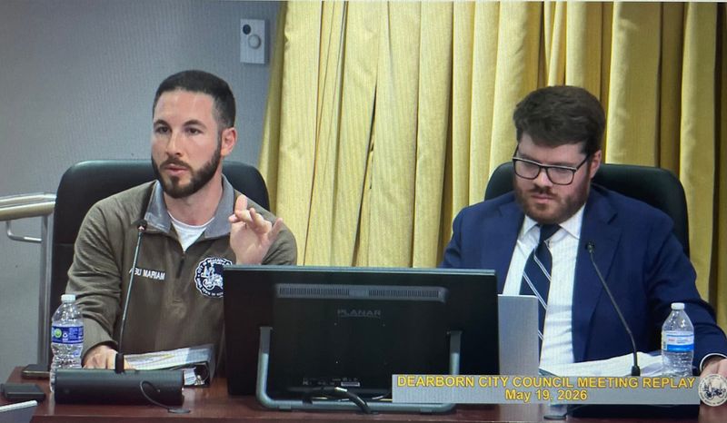 Dearborn Mayor Abdullah Hammoud (left) speaks at a city council meeting on May 19, 2026, about the Ashura Project's annual Ashura procession in Dearborn. Screenshot from city livestream.