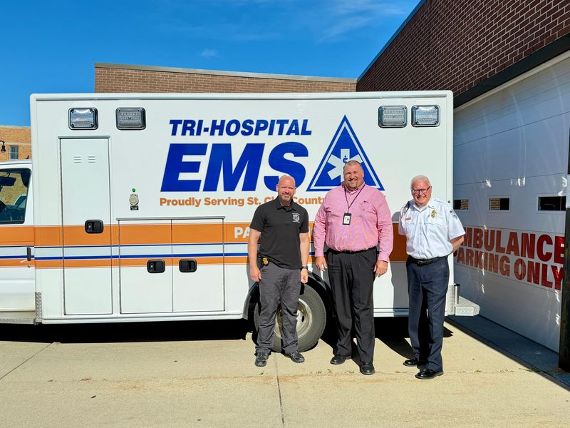 Matthew Reeves of Marysville Public Safety (left), Tim Niggemeyer of Tri-Hospital EMS (center) and Jeff White of Richmond Lenox EMS Ambulance Authority (right) and stand for a photo on June 15, 2026, outside Tri-Hospital EMS Central Station in Port Huron.