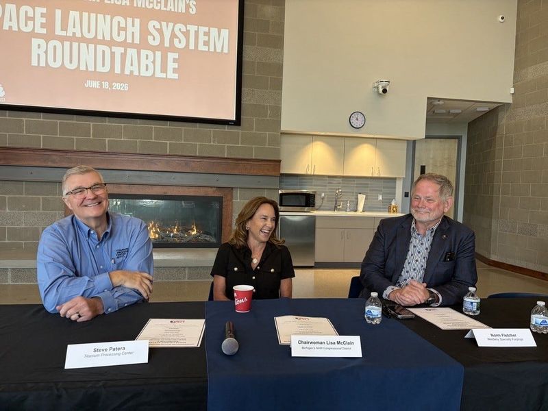 U.S. Rep. Lisa McClain, R-Bruce Township, laughs with Steve Patera of the Titanium Processing Center, left, and Norm Fletcher of Weldaloy Specialty Forgings after aerospace manufacturers and suppliers made the case for more consistent federal space policy in Orion Township on June 18, 2026.