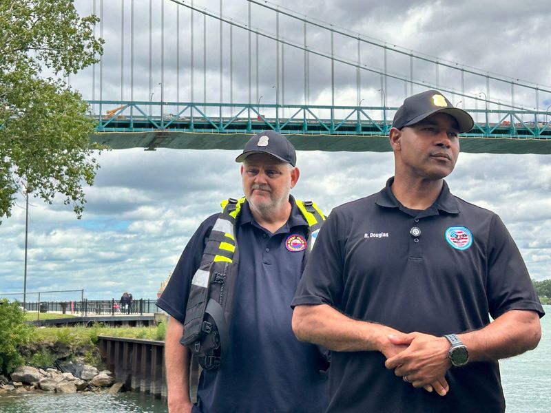 James Kean, a boat operator with the Detroit Police Department Harbormaster Unit, left, and Detroit police Lt. Robert Douglas with the Harbormaster Unit, speak with the media during a press conference, Thursday, June 18, at DFD Marine Operations headquarters on the Detroit River.