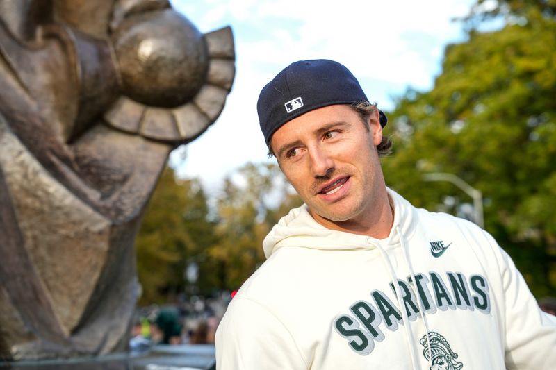 Oct 25, 2025; East Lansing, Michigan, USA; Former Michigan State quarterback Connor Cook meets with fans at the Spartan Statue before a game against the Michigan Wolverines at Spartan Stadium. Mandatory Credit: Brendan Mullin-Imagn Images