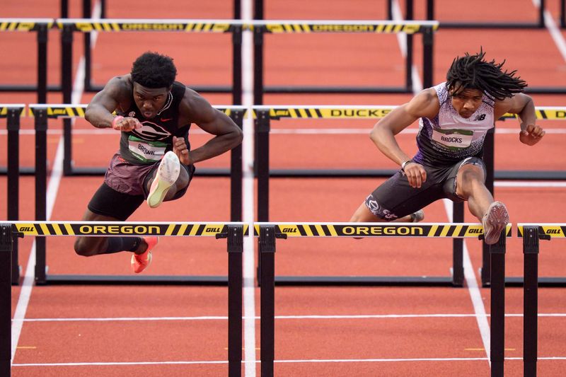 Zacchaeus Brocks, right, narrowly outpaces Le'Ezra Brown to win the men’s 110-meter hurdles in 12.975 seconds, a national high school record, June 19 at the USATF U20 championships at Hayward Field.