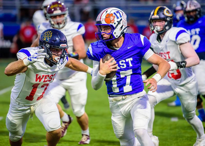 Salem's Luke Creighton rushes during the Michigan High School Football Coaches Association East-West All-Star Game on Saturday, June 21, 2026, at Lawrence Tech University in Southfield.