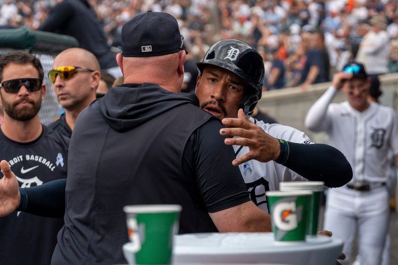 Detroit Tigers Jahmai Jones (18) celebrates in the dugout after scoring the tying run against the Chicago White Sox at Comerica Park in Detroit on Sunday, June 21, 2026.