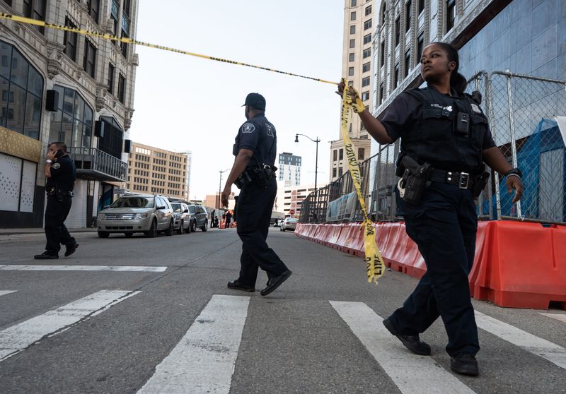Detroit police officers on scene of a police officer shooting near Bates and Cadillac Square in downtown Detroit before the start of the 68th annual Ford Fireworks at Hart Plaza in downtown Detroit on Monday, June 22, 2026.