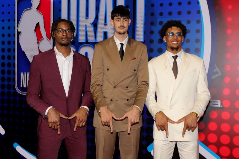 Michigan draft prospects Morez Johnson Jr. (left to right) Aday Mara and Yaxel Lendeborg pose for photos on the red carpet before the 2026 NBA draft at Barclays Center.