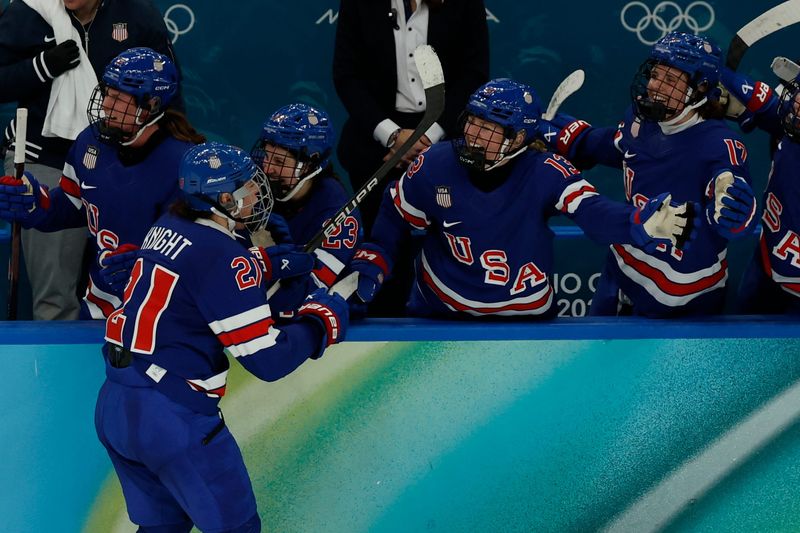 Hilary Knight (21) of the United States high fives the bench after scoring a goal against Canada in the women's ice hockey gold medal game during the Milano Cortina 2026 Olympic Winter Games Feb 19, 2026 at Milano Santagiulia Ice Hockey Arena.