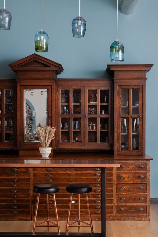 The bar and storage area was constructed of a linen press that once graced a Poletown church.