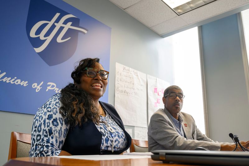 Detroit Federation of Teachers President Lakia Wilson-Lumpkins, left, and Executive Vice President Jason Posey speak about the union ratification of a new contract during a press conference at the organization’s headquarters in Detroit, June 24, 2026.
