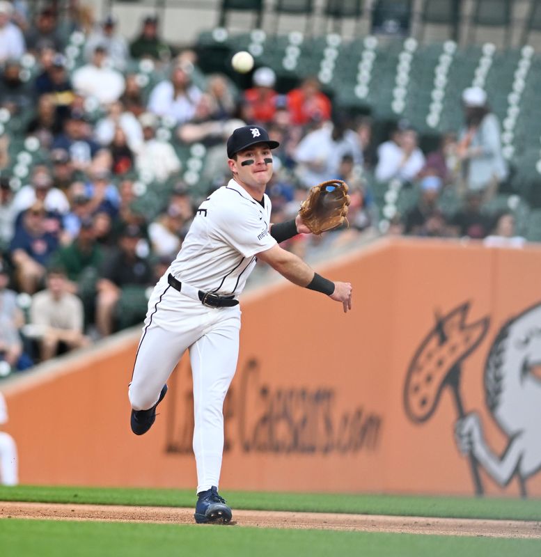 After bobbling a ball, Tigers shortstop Kevin McGonigle (7) recovers and gets the out at first in the second inning. Detroit Tigers take on the New York Yankees on June 24, 2026 at Comerica Park in Detroit.