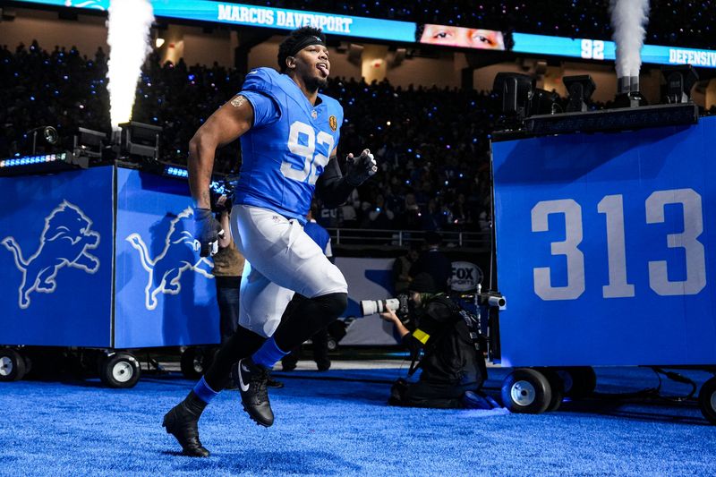 Detroit Lions defensive end Marcus Davenport (92) runs onto the field for players introduction before the Thanksgiving game against Green Bay Packers at Ford Field in Detroit on Thursday, Nov. 27, 2025.