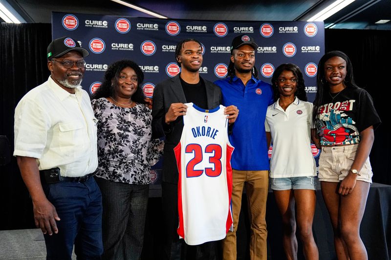 From left, Detroit Pistons first round draft Ebuka Okorie, center, with his father Charles Okorie, far left, mother Igeoma Okorie, brother Emeka Okorie, center right, sisters Adaeze Okorie, and  Kelechi Okorie during Ebuka’s introductory press conferences at Detroit Pistons Performance Center in Detroit on Thursday, June 25, 2026.