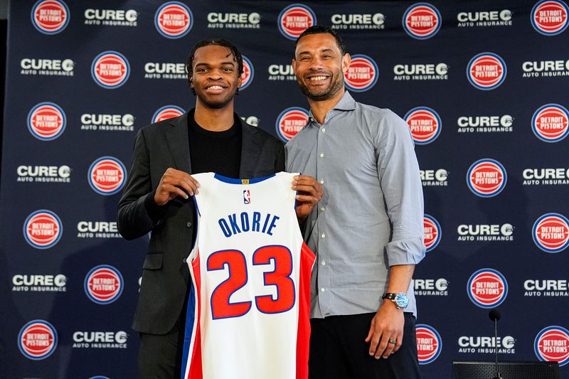 Detroit Pistons first round draft Ebuka Okorie, left, poses with President of Basketball Operations Trajan Langdon during his introductory press conference at Detroit Pistons Performance Center in Detroit on Thursday, June 25, 2026.