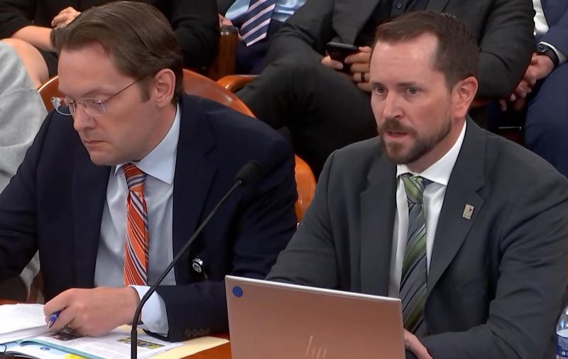 Adam Carlson, senior vice president for advocacy at Michigan Health and Hospital Association, testifies Thursday in front of the House Government Operations Committee on bills that would create a Hospital Cost Review Board that would be empowered to reject medical price increases. He was joined by Ben Frederick, a former state lawmaker from Owosso who is now a lobbyist for Memorial Healthcare in Owosso.