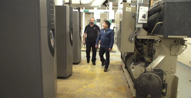Dearborn Public Schools director of communications David Mustonen and the schools vice-director of plant operations talk about the new boilers at Oakman Elementary School in Dearborn, discussing the school's heating systems. A video of them touring the site was filmed and then posted in March 2026.