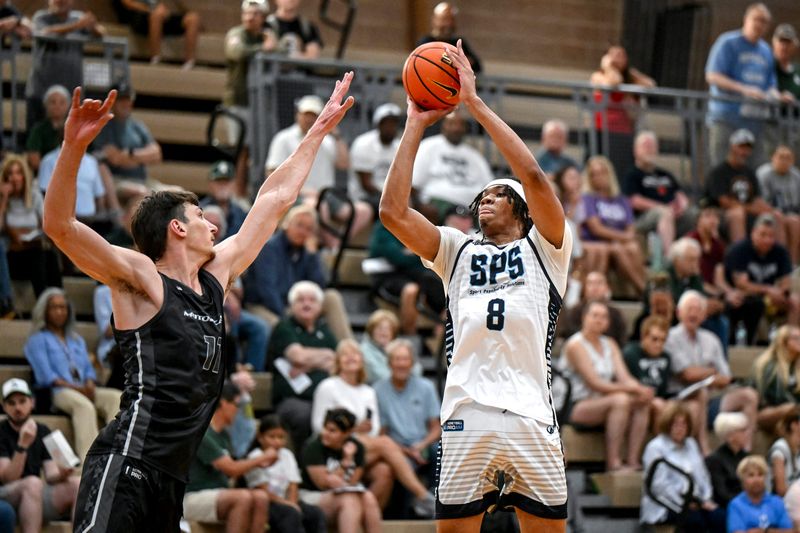 Team SPS and Michigan State's Julius Avent, right, scores as MSU teammate and Team Motorcars’ Anton Bonke defends during the Moneyball Pro-Am on Thursday, June 25, 2026, at Holt High School.