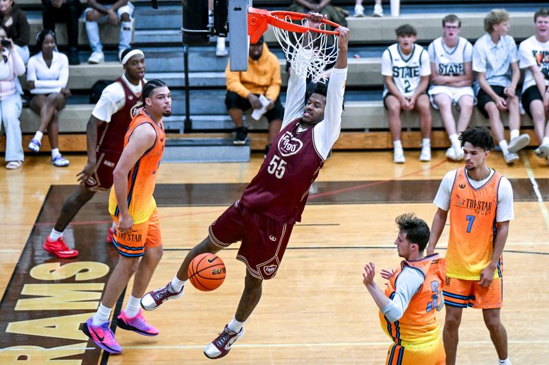 Team Faygo and Michigan State's Jasiah Jervis gets the put-back dunk against Team Tri-Star during the Moneyball Pro-Am on Thursday, June 25, 2026, at Holt High School.