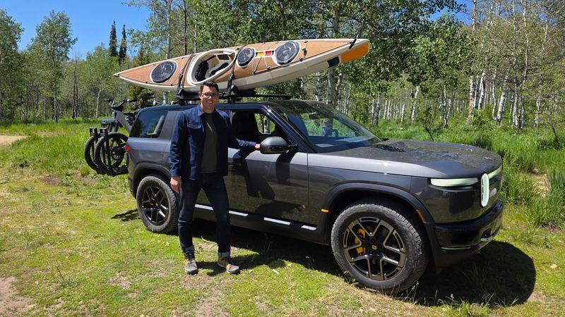 RJ Scaringe with his $45,000 compact SUV, the 2027 Rivian R2. The EV startup's CEO is hoping its first mainstream offering will sell like Tesla's Model Y and Model 3.
