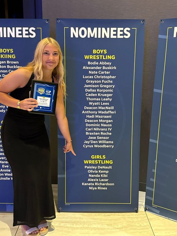 Airport's Olivia Kemp points to her pace among the nominees for girls wrestler of the year at the 2025-26 Detroit High School Sports Awards Show at the Motor City Casino Hotel on June 24. Kemp and New Boston Huron girls soccer player Miley Skamiera were named the top athletes in their sports.