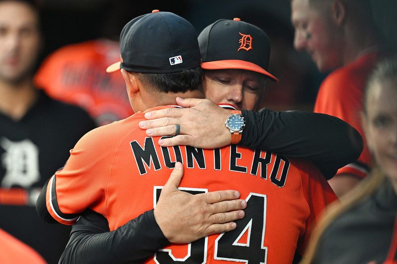 Tigers starting pitcher Keider Montero (54) gets a hug in the dugout from manager A.J. Hinch after throwing seven shutout innings against the Astros at Comerica Park.
