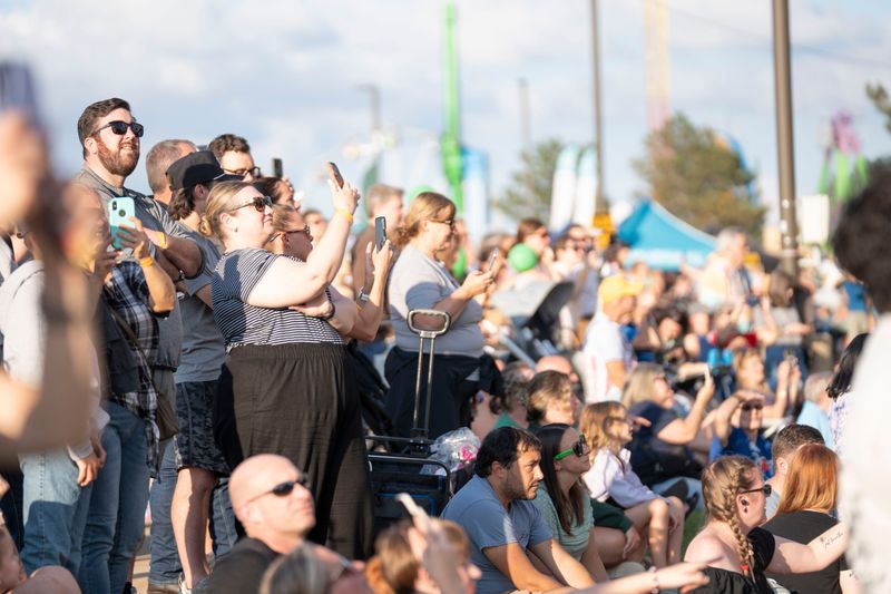 Spectators watch balloons launch at the Michigan Challenge Balloonfest in Howell, Mich. on Friday, June 26, 2026.