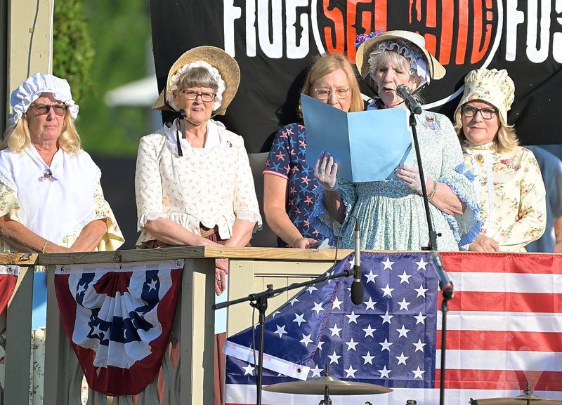Lindy Brozovic, front, descended from an American Revolutionary War soldier, and other members of the Daughters of the American Revolution's Alexander Macomb Chapter read the Declaration of Independence to start the Independence Day Celebration in Mount Clemens, Michigan on June 26, 2026.