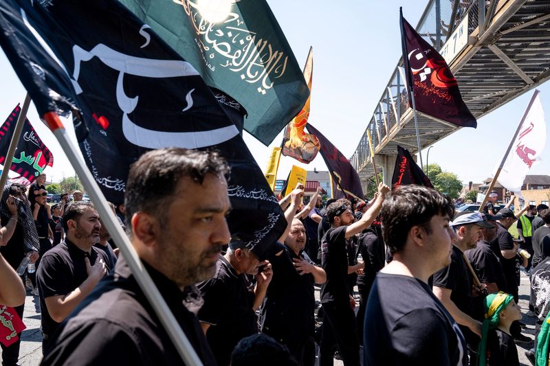 Participants march in the Ashura Project's annual "March for Justice" in Dearborn on Sunday, June 28. The march marks the Shia Muslim holiday of Ashura that commemorating a 7th century battle in Iraq for justice.