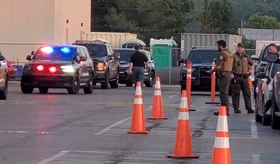 Deputy Coldwater Police Chief Patrick Beeman walking to car at Clemens pork plant Monday, June 29.