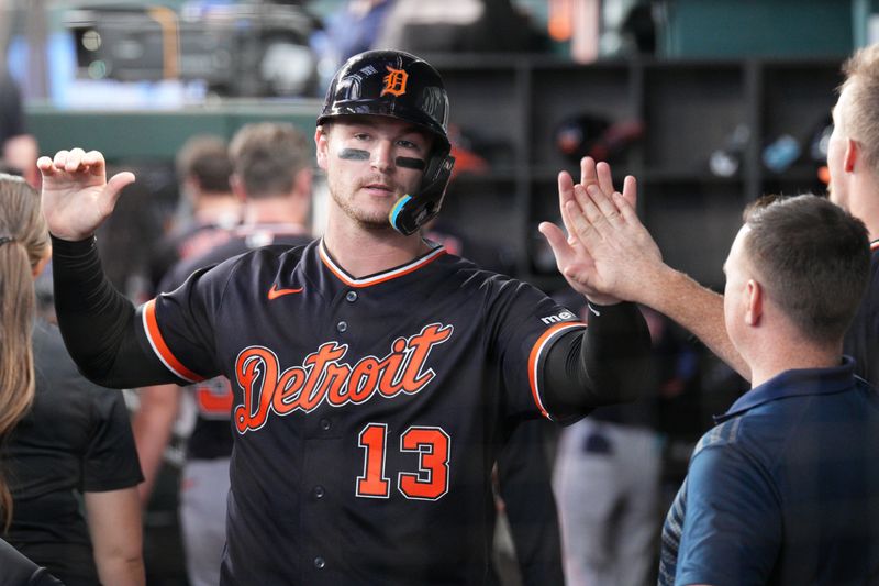 Tigers catcher Dillon Dingler (13) is greeted in the dugout after scoring against the Rangers during the fifth inning.