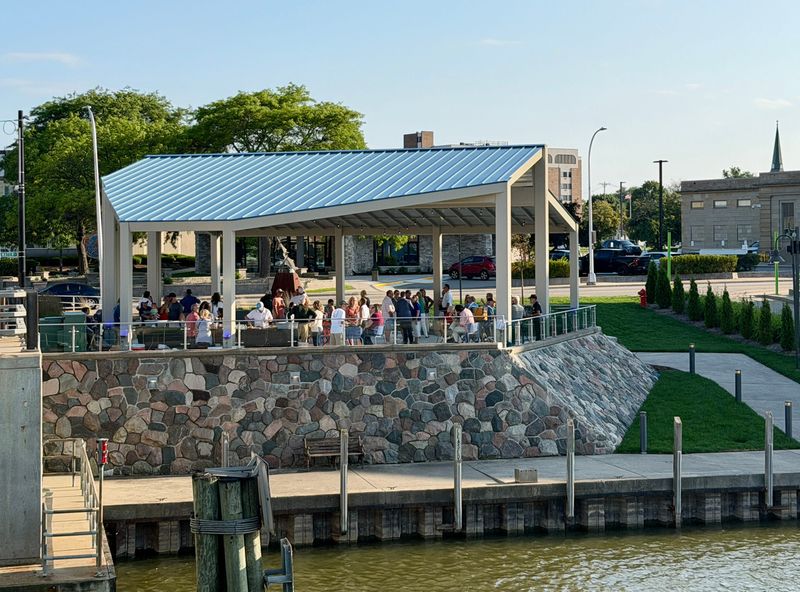 Community members attend a reception celebrating the completion of the Military Street Bridge Pocket Park in Port Huron on July 6, 2026.