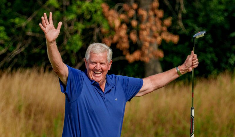 Colin Montgomerie celebrates one of his two holes-in-one at Wee Course at Harbor Shores Resort in Michigan.