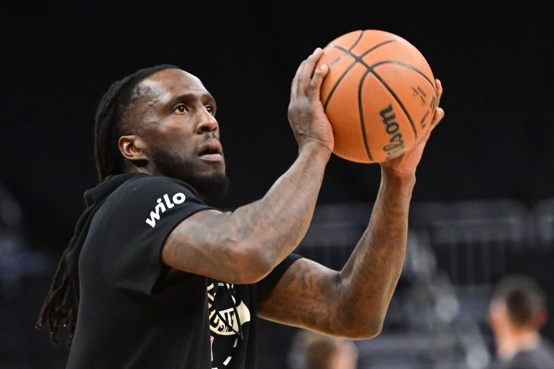 Feb 24, 2026; Milwaukee, Wisconsin, USA; Milwaukee Bucks guard Taurean Prince (12) warms up before game against the Miami Heat at Fiserv Forum. Mandatory Credit: Benny Sieu-Imagn Images