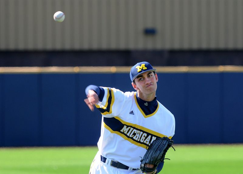 Bedford graduate Jackson Lamb warms up before a University of Michigan baseball game.