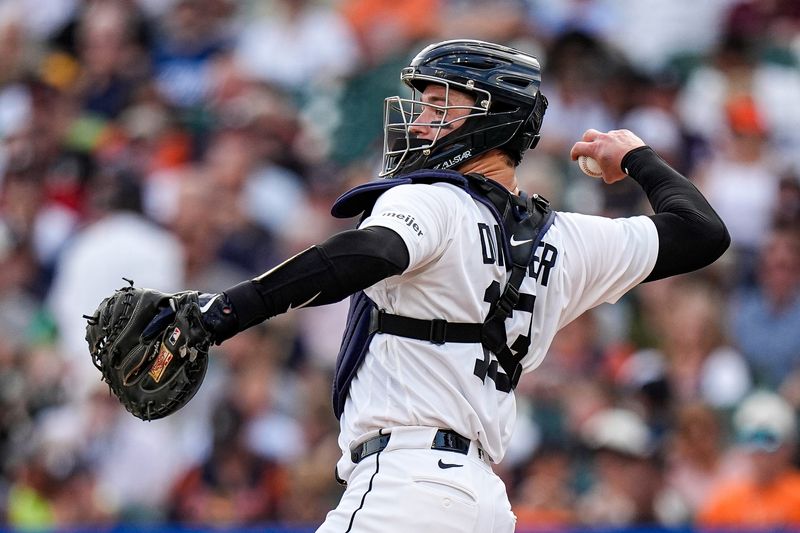 Detroit Tigers catcher Dillon Dingler (13) practices a throw after an injury during the second inning against the Athletics at Comerica Park in Detroit on Wednesday, July 8, 2026.