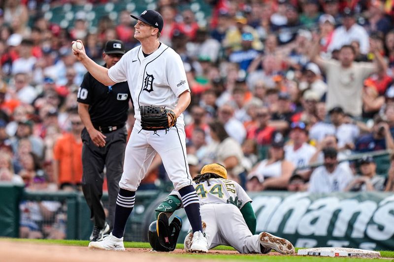 Tigers pitcher Troy Melton (52) reacts to a play after Athletics second baseman Joshua Kuroda-Grauer (44) takes first base during the second inning.