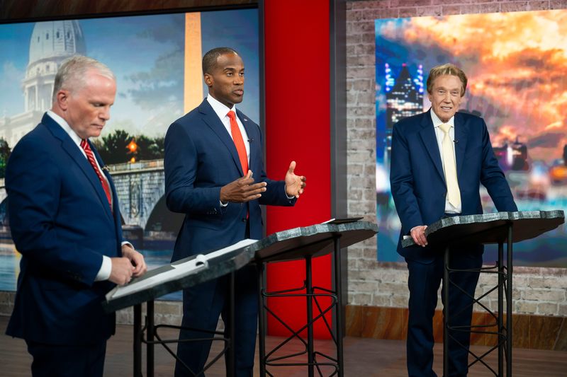 From left, former Michigan Attorney General Mike Cox, U.S. Rep. John James and Perry Johnson, the three Republican candidates for governor in Michigan, participate in a debate hosted by WJBK-TV (Fox 2) on Wednesday, July 8, 2026.