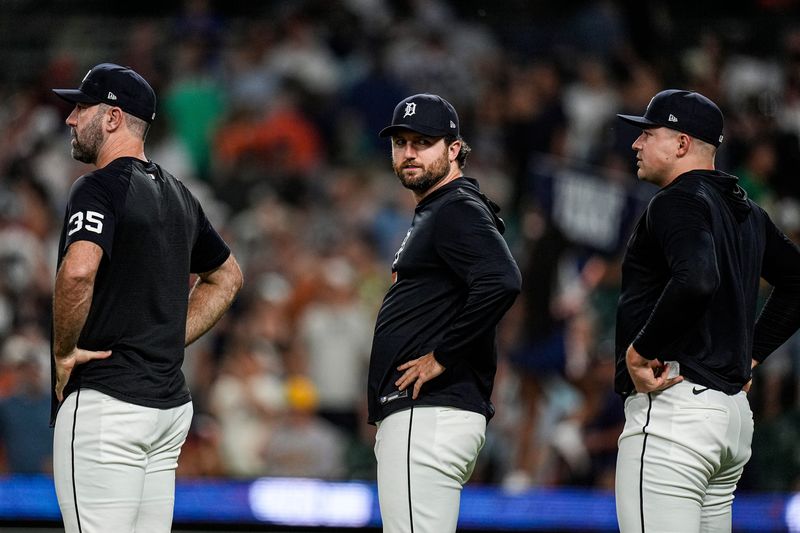 From left, Detroit Tigers pitcher Justin Verlander, pitcher Casey Mize, and pitcher Tarik Skubal in line to congratulate teammates for 6-1 win over Athletics at Comerica Park in Detroit on Wednesday, July 8, 2026.