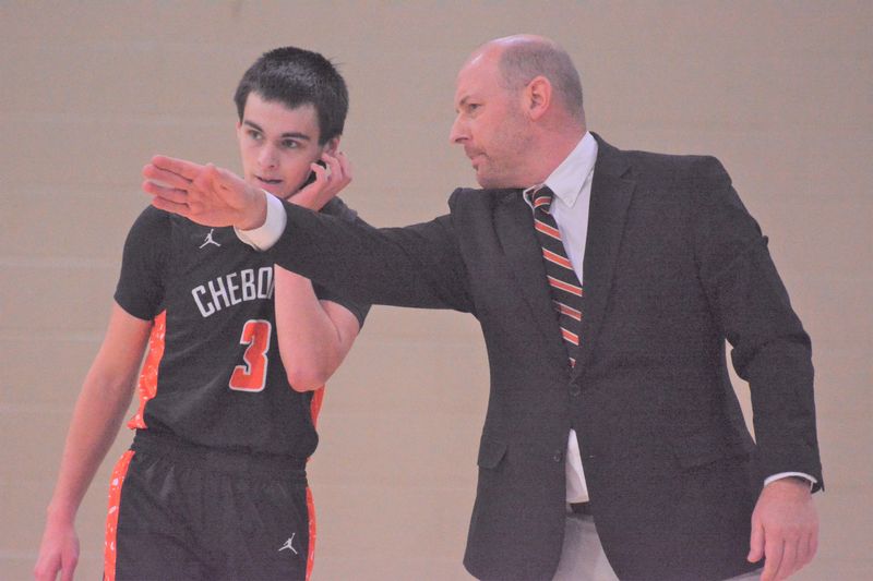 Cheboygan boys basketball coach Jason Friday gives directions to Gavin Smith during a game at St. Ignace last season. Friday did one of the best coaching jobs in the area during the 2025-26 school year, guiding the Chiefs to an 18-7 record and a district championship.